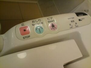 Japanese toilet in our hotel room - a close up of a toilet with a remote control